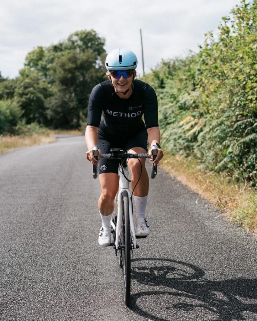 METHOD athlete riding a quiet B-road at speed